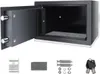 An open safe with its accessories laid out below. Produktbild-Vorschau