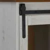 A close-up view of a sliding door mechanism on a white wooden cabinet. Náhľad obrázku produktu