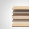 A stack of layered materials, likely representing furniture components, against a plain background. Náhľad obrázku produktu