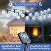 A split image showing a house with solar-powered string lights. The left side depicts daytime with the lights off, and the right side shows nighttime with the lights on. A solar panel is visible in the foreground. Produktbild-Vorschau
