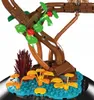 A close-up view of a model tree with red roses and green leaves, set against a blue base with orange foliage. Náhľad obrázku produktu