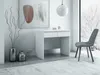 A minimalist white desk with drawers in a brightly lit room with a window showing a snowy landscape. Náhľad obrázku produktu