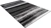 A rectangular rug with a modern abstract design in shades of black, gray, and white. Produktbild-Vorschau