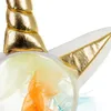 A close-up of a unicorn headband with a golden horn and colorful tulle. Anteprima dell’immagine prodotto