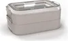A studio shot of a two-tiered lunch box. Voir les images du produit