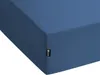 A close-up view of a blue fitted sheet, showing a corner with a small black tag. Náhľad obrázku produktu