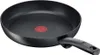 A black frying pan with a red indicator in the center. Podgląd zdjęcia produktu