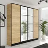 A wardrobe with wood-effect doors and mirrored panels, set in a bright, modern room with large windows and plants. Voir les images du produit