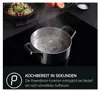 A pot of boiling water on a black induction cooktop, with text overlay describing a feature. Anteprima dell’immagine prodotto