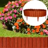 A garden scene with flowers and grass, featuring a close-up inset of a wooden-look plastic garden border. Produktbild-Vorschau