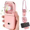 A person is holding a pink portable fan, and other views of the fan are shown. Produktbild-Vorschau