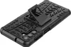 A black phone case with a tire tread pattern and a kickstand is shown against a white background. Produktbild-Vorschau