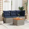 An outdoor patio setting with a wicker couch and coffee table. Produktbild-Vorschau
