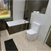 A modern bathroom with a bathtub and toilet. Produktbild-Vorschau