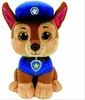 A plush toy dog wearing a police uniform and hat. Voir les images du produit