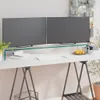 A desk setup with two monitors on a transparent glass riser, a keyboard, mouse, and some desk accessories. Náhled obrázku produktu