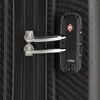 A close-up view of a black suitcase's zipper and TSA lock. Produktbild-Vorschau