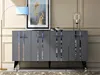 A modern living room setting with a grey sideboard, a floor lamp, and artwork. Anteprima dell’immagine prodotto