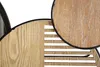 Close-up view of a wooden mirror with a black frame, showing the wood grain and slatted design. Produktbild-Vorschau