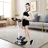 A woman is using a fitness stepper in a living room. Podgląd zdjęcia produktu