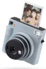 A Fujifilm Instax Square SQ 1 camera with a photo developing. Anteprima dell’immagine prodotto