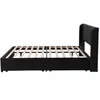 A side view of a black upholstered bed frame with a slatted mattress support. Produktbild-Vorschau