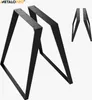Two black metal table legs are shown in the foreground, with two smaller ones in the background. Voir les images du produit
