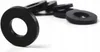 A group of black rubber washers are arranged on a white background, with one washer in the foreground in sharp focus. Anteprima dell’immagine prodotto