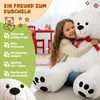 A young girl hugging a large white teddy bear in a room with children's furniture. Anteprima dell’immagine prodotto