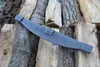 A metal tool resting on a pile of firewood. Náhled obrázku produktu