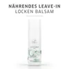 A product shot of a bottle of Wella Nutricurls Curlixir Balm. Voir les images du produit