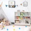 A child's playroom with a teepee, toys, and a white bookshelf. Voir les images du produit