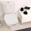 A white toilet with a white seat in a bathroom setting. Anteprima dell’immagine prodotto