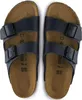 A pair of blue Birkenstock Arizona sandals are shown from a top-down view against a white background. Produktbild-Vorschau