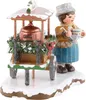 A festive figurine of a person selling hot drinks from a cart, decorated for winter. Produktbild-Vorschau