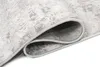 A close-up view of a rolled-up rug, showing the texture and edge. Anteprima dell’immagine prodotto