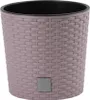 A close-up studio shot of a pink woven plant pot with a black interior. Anteprima dell’immagine prodotto