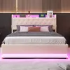 A modern bedroom with a beige upholstered bed frame featuring LED lighting. Produktbild-Vorschau