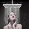 A woman is showering under a square shower head. Podgląd zdjęcia produktu