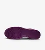The underside of a Nike Dunk Low Retro sneaker with a purple sole. Produktbild-Vorschau