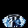 A product shot of a perfume bottle with a silver cap and a clear, blue, faceted base, set against a black background. Náhľad obrázku produktu