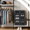 A closet or storage area with clothing and shoe storage units. Podgląd zdjęcia produktu