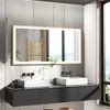 A modern bathroom vanity with two sinks and a large illuminated mirror. Náhled obrázku produktu