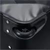A close-up view of the wheel and handle of a black trolley bag. Anteprima dell’immagine prodotto
