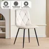 A beige upholstered dining chair with black metal legs, set against a light-colored wall and floor. Informational icons and text are present in the upper left corner. Náhled obrázku produktu