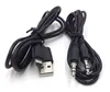 Two black cables are laid out on a white background. One cable has a USB connector and a micro-USB connector. The other cable has two 3.5mm audio jacks. Produktbild-Vorschau