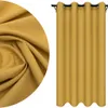 A close-up of yellow fabric and a yellow curtain hanging on a rod. Náhled obrázku produktu