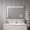 A modern bathroom vanity with a sink and a large LED mirror.