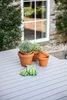 Gardening supplies on a table outdoors. Produktbild-Vorschau