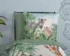 A duvet cover with a jungle animal print is displayed on a bed. Anteprima dell’immagine prodotto
